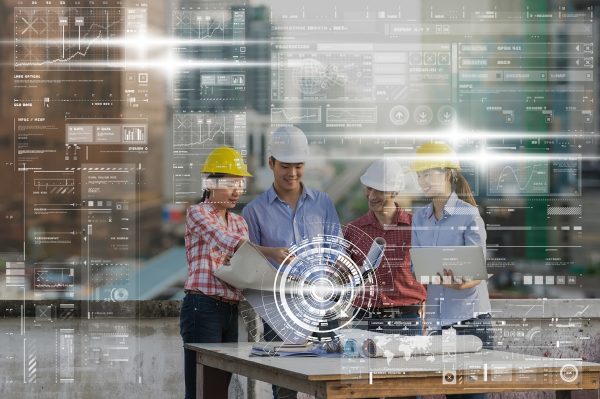 Happy professional construction engineers working with Colleagues Teamwork and equipment blueprint and laptop at the building site place over the over the technology digital virtual screen background.