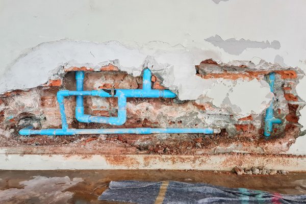 Exposed pipes from water damage